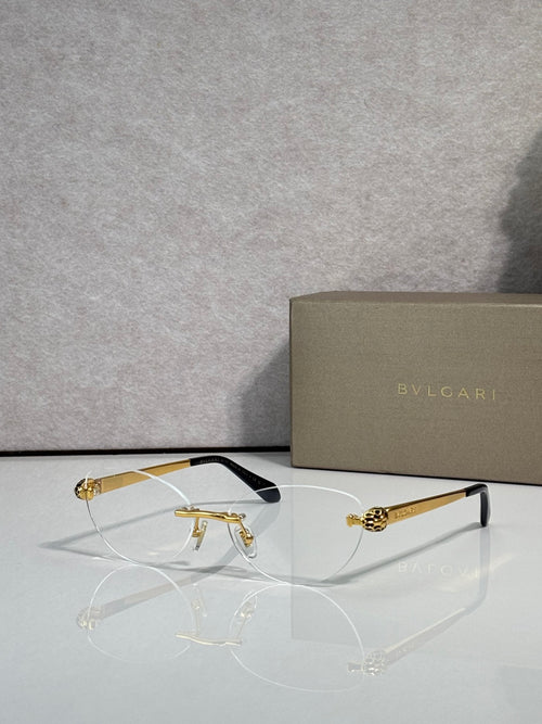 Bvlgari eyeglasses with tinted amber lenses, gold frame and black temple tips