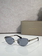 Bvlgari eyeglasses with blue-gray lenses, gold frame and black temple tips