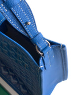 Goyard blue patterned bag with metal ring attachment and leather strap attachment