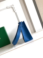 Goyard blue crossbody bag with patterned body, adjustable shoulder strap, and top handle