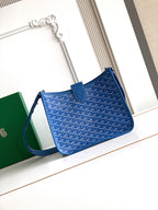 Goyard blue crossbody bag with patterned canvas, leather trim, and front flap pocket