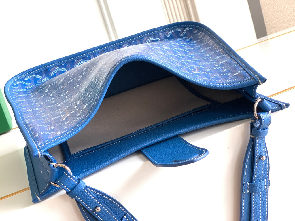 Goyard blue bag interior with open top, leather lining, and adjustable shoulder strap
