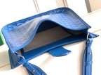 Goyard blue bag interior with open top, leather lining, and adjustable shoulder strap