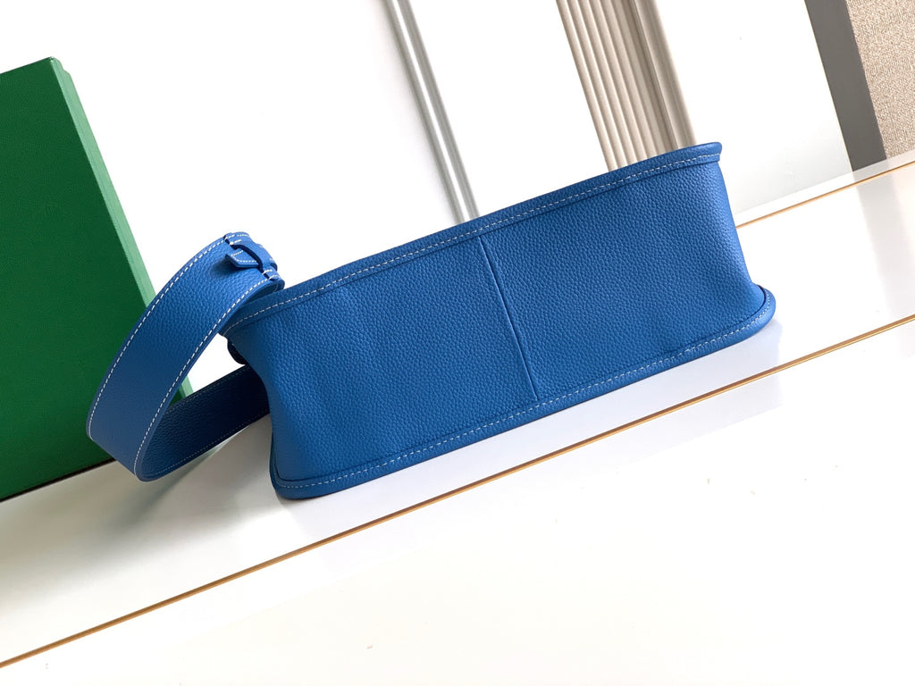 Goyard blue flat clutch bag with leather strap, smooth panel, and stitched edges