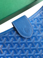 Goyard blue patterned bag showing leather snap flap and pebble-grain trim