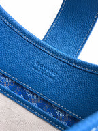 Goyard blue handle and seam detail on patterned canvas with contrast stitching