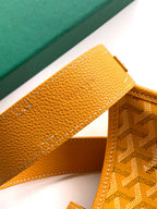 Close-up of mustard leather strap holder and monogram canvas side panel