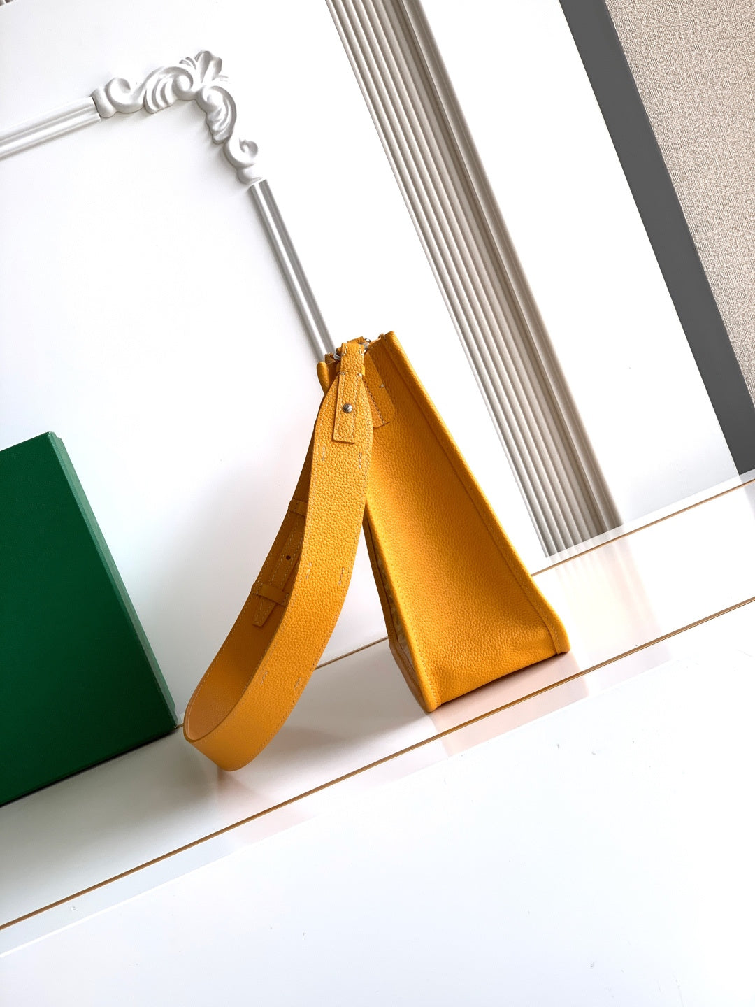 Mustard yellow shoulder bag with top handle and long adjustable strap