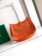 Orange monogram canvas tote bag with leather top handle and shoulder strap