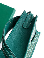 Teal leather and patterned canvas Goyard bag with top handle strap detail