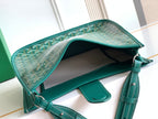 Teal Goyard bag open with interior lining and leather shoulder strap