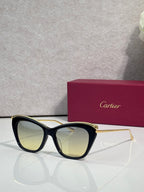 Cartier sunglasses with black frame and warm yellow tinted lenses