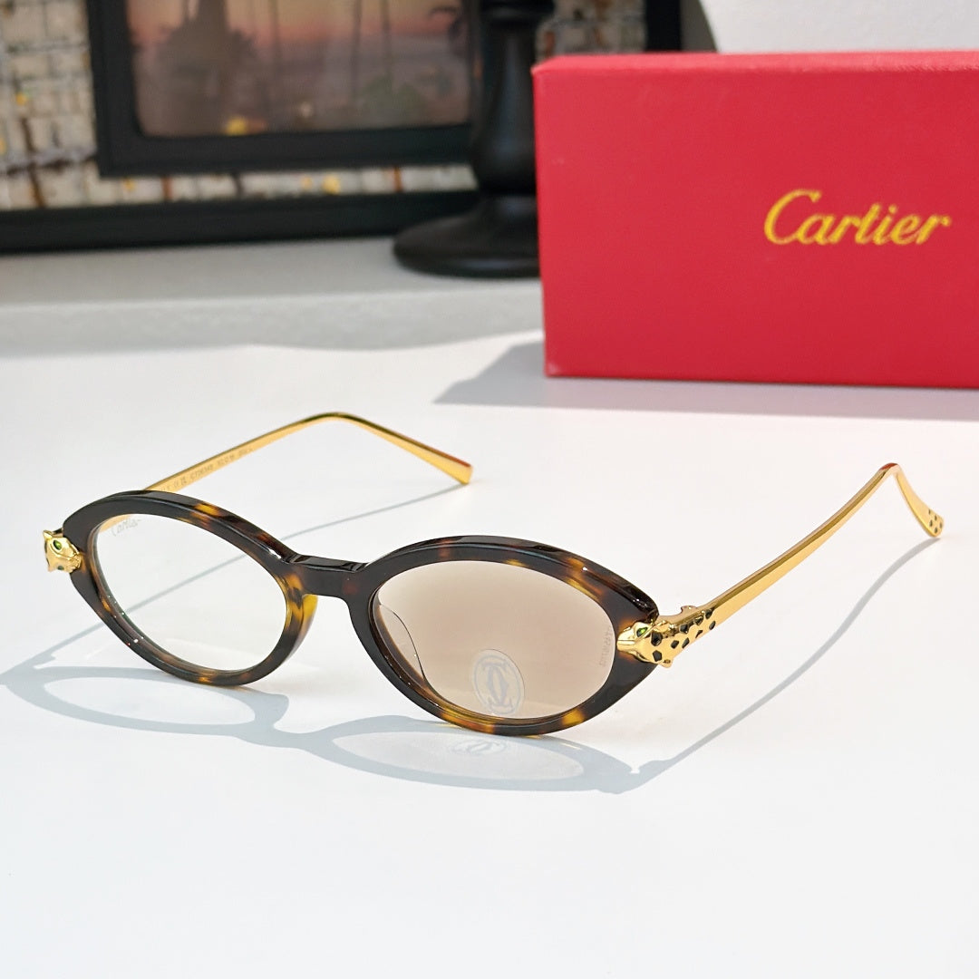 Tortoise eyeglasses with gold temples and beige-tinted lenses, round-to-cat-eye style.