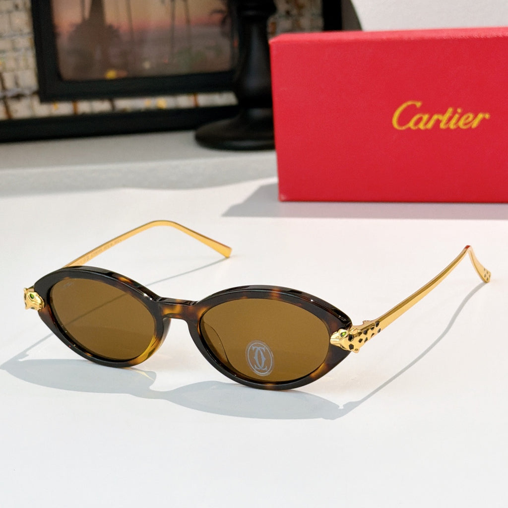 Tortoise eyeglasses with gold temples and warm brown-tinted lenses, round-to-cat-eye style.