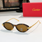 Tortoise eyeglasses with gold temples and warm brown-tinted lenses, round-to-cat-eye style.