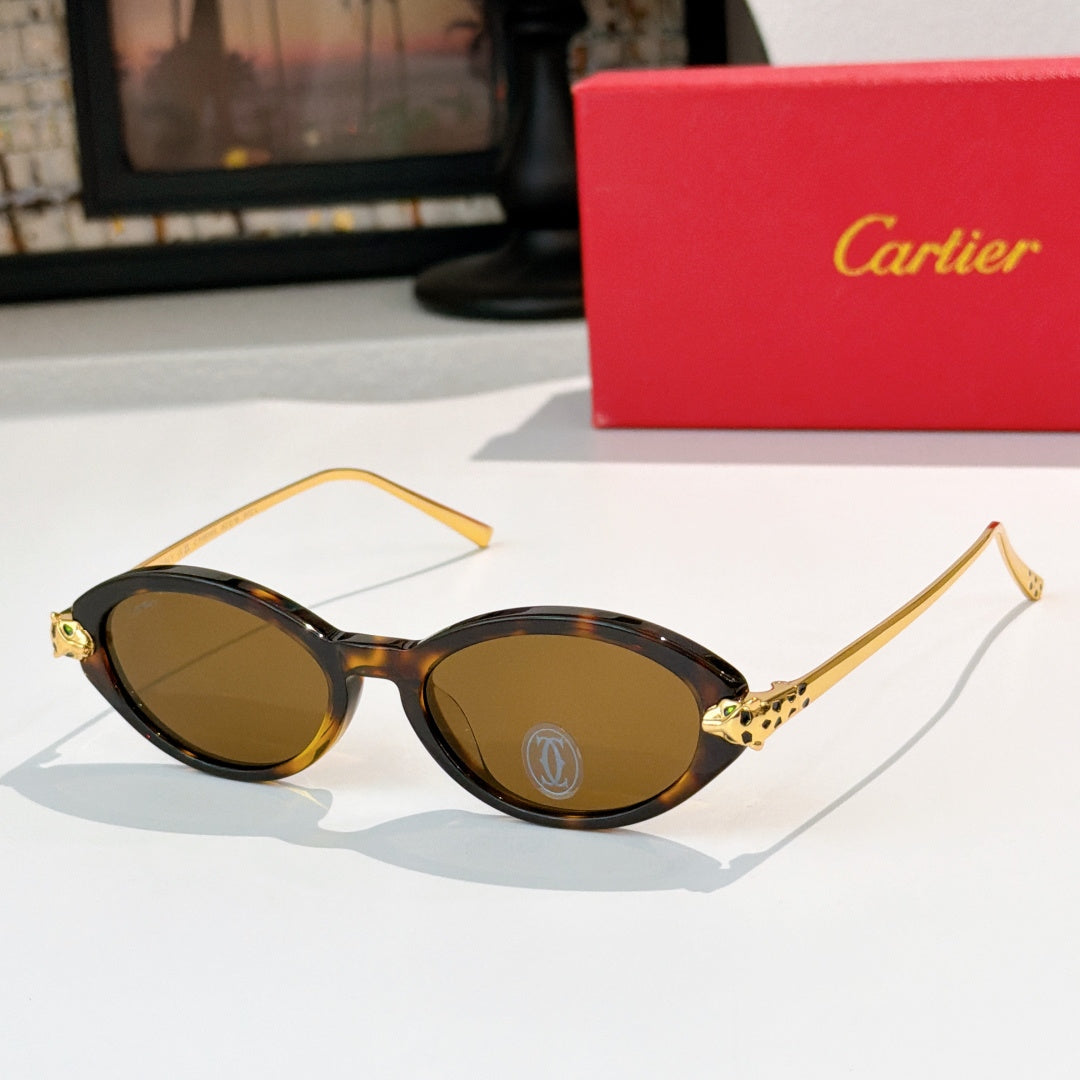 Tortoise eyeglasses with gold temples and warm brown-tinted lenses, round-to-cat-eye style.