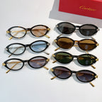 Assorted oval sunglasses with gold accents, including dark, blue, brown, green, and clear-tint styles.