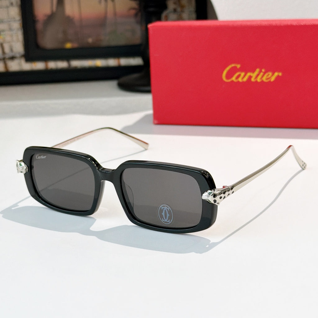 Cartier glasses with black frames, dark lenses, and silver-toned temples