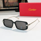 Cartier glasses with black frames, dark lenses, and silver-toned temples