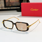 Cartier glasses with tortoiseshell frames, brown lenses, and gold-tone temples