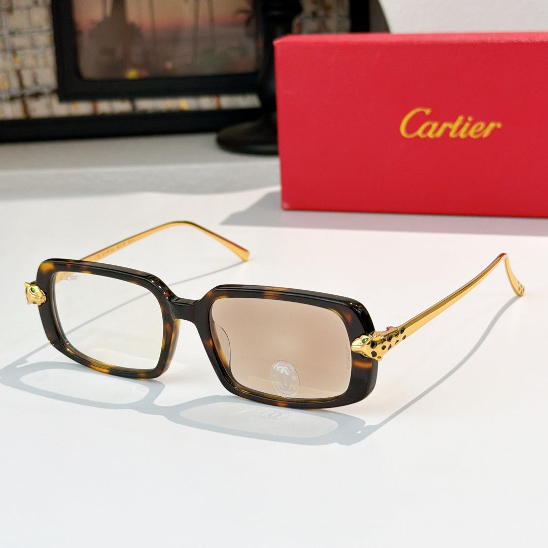 Cartier glasses with tortoiseshell frames, brown lenses, and gold-tone temples
