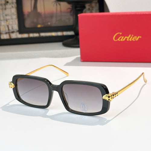 Cartier glasses with black frames, dark lenses, and gold-tone temples