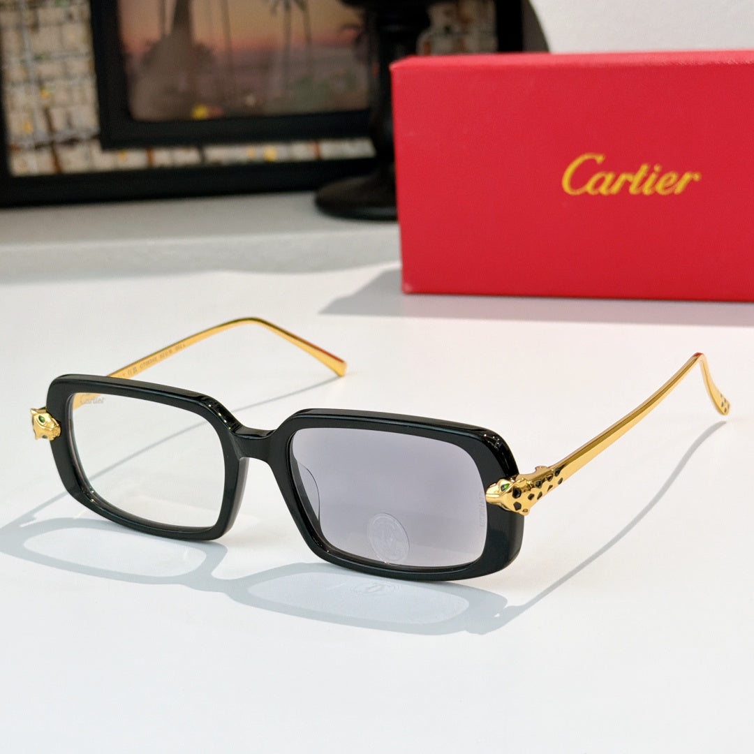 Cartier glasses with black frames, clear lenses, and gold-tone temples