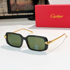Cartier glasses with black frames, green-tinted lenses, and gold-tone temples