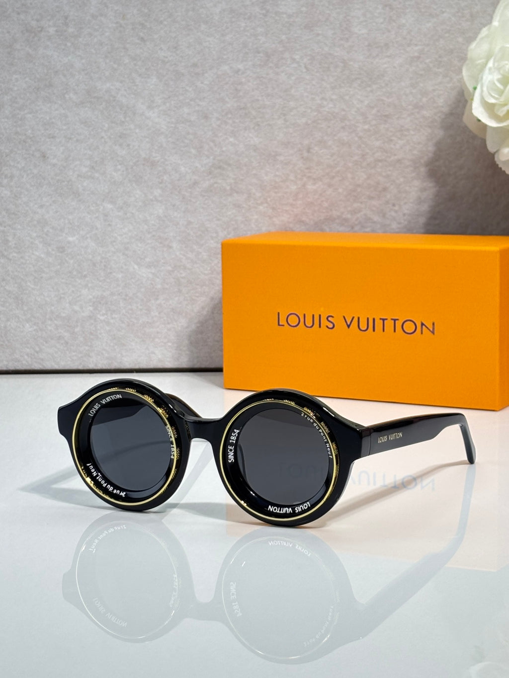 Louis Vuitton sunglasses, black round frames with dark lenses