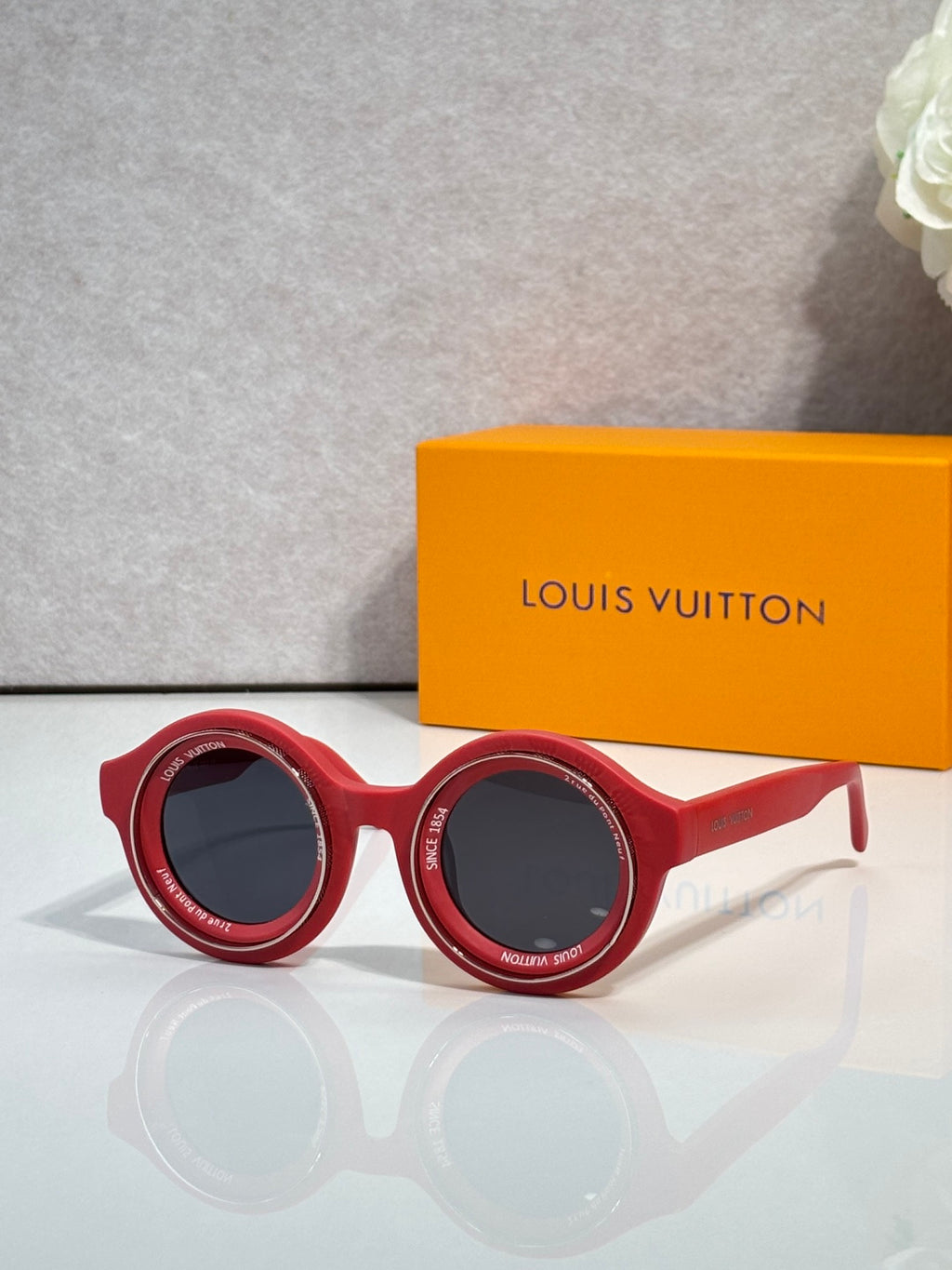 Louis Vuitton sunglasses, red round frames with dark lenses