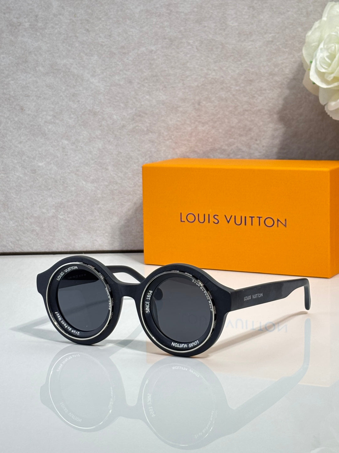 Louis Vuitton sunglasses, black round frames with dark lenses