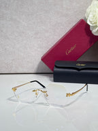 Clear eyeglasses with gold details and light gray tinted lenses