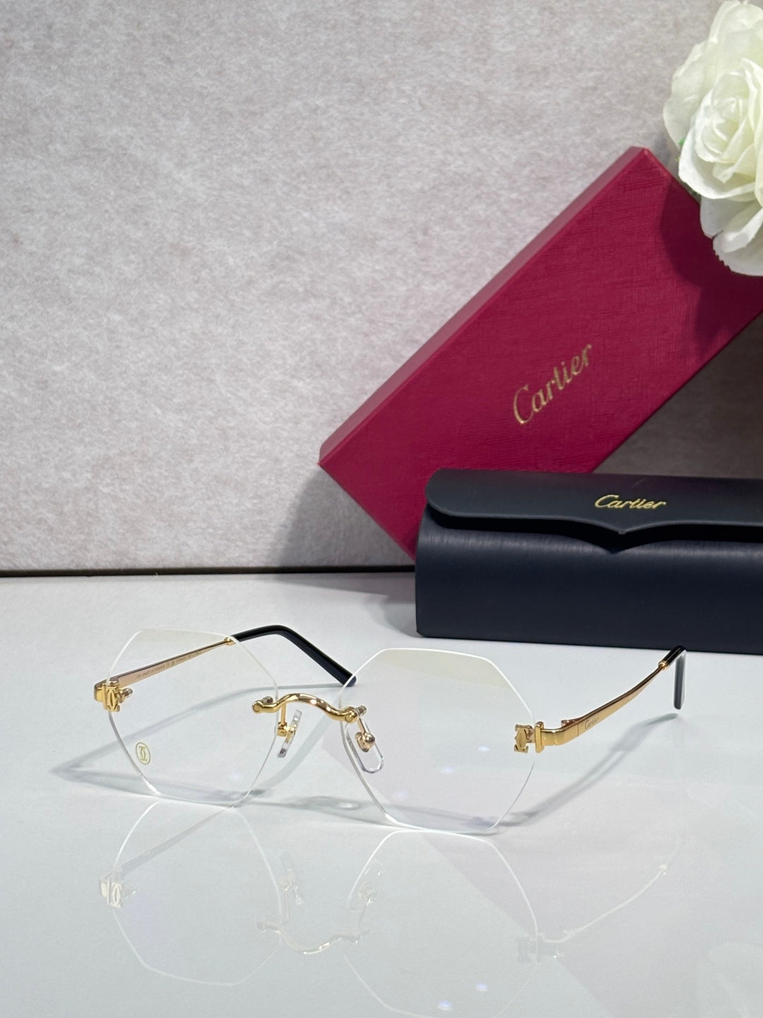 Clear eyeglasses with gold details and light gray tinted lenses