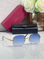 Cartier glasses with blue-tinted lenses, black frame, and gold-tone hardware