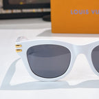 White cat-eye sunglasses with dark tinted lens and gold LV logo on temple arm.