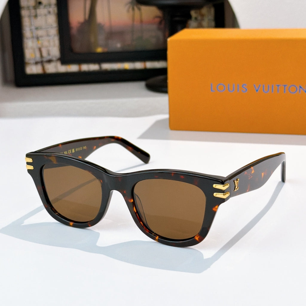 Cat-eye sunglasses with tortoiseshell frames and brown tinted lenses, gold LV logo on temples.