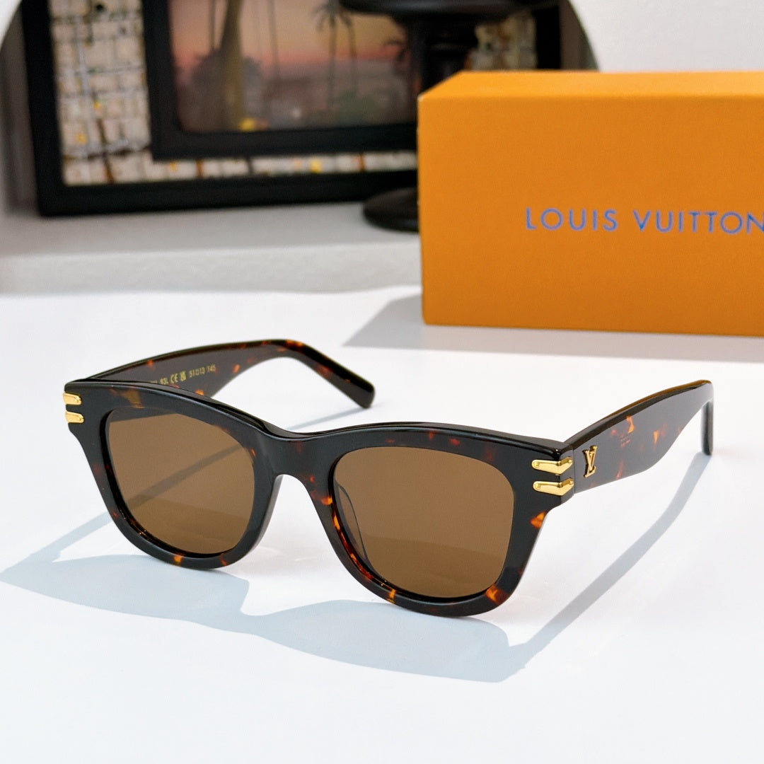 Cat-eye sunglasses with tortoiseshell frames and brown tinted lenses, gold LV logo on temples.