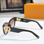 Black cat-eye sunglasses side view with gold LV logo plates and dark lenses