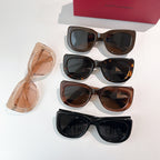 Set of four sunglasses with black, brown, and translucent frames and tinted lenses.