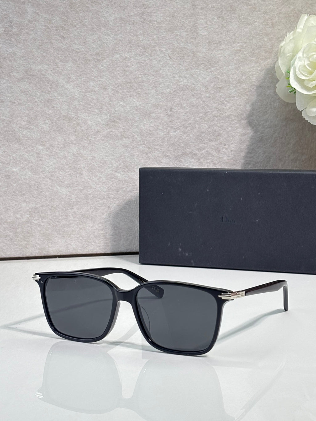 Dior eyeglasses with black frames and dark tinted lenses