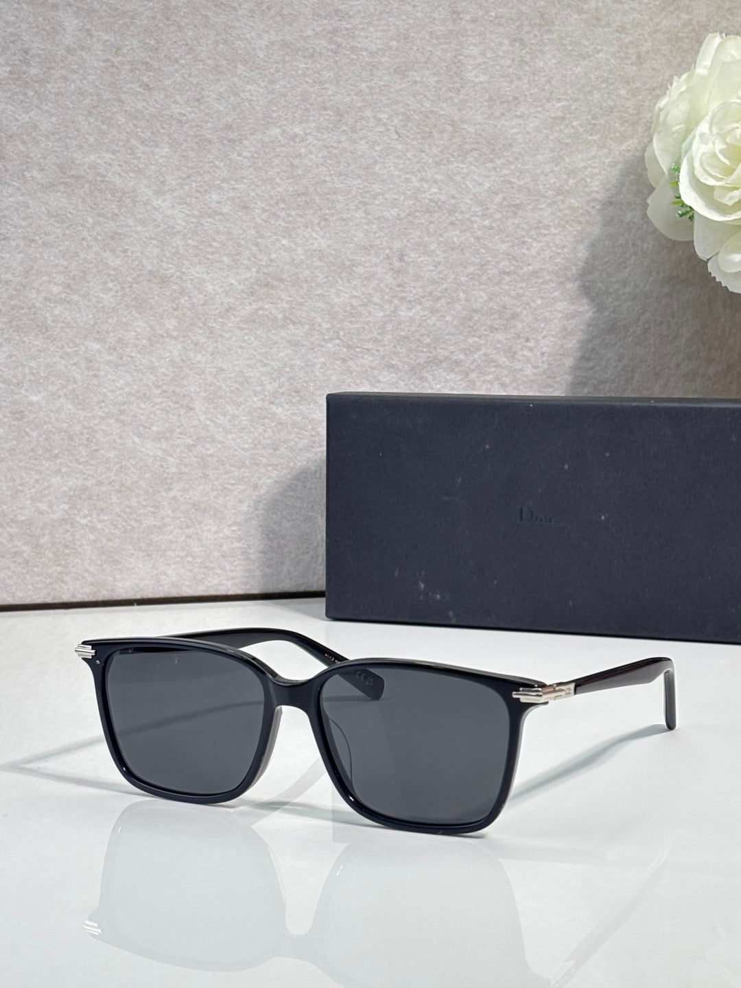 Dior eyeglasses with black frames and dark tinted lenses