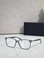 Dior eyeglasses with blue-gray rectangular frames and clear lenses