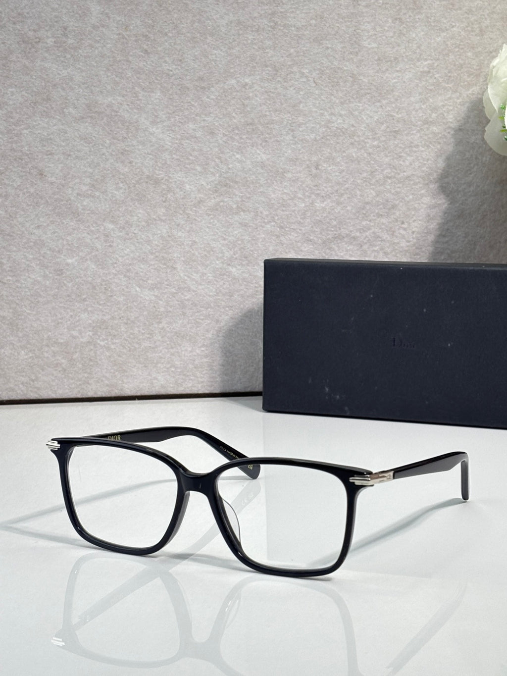Dior eyeglasses with black rectangular frames and clear lenses