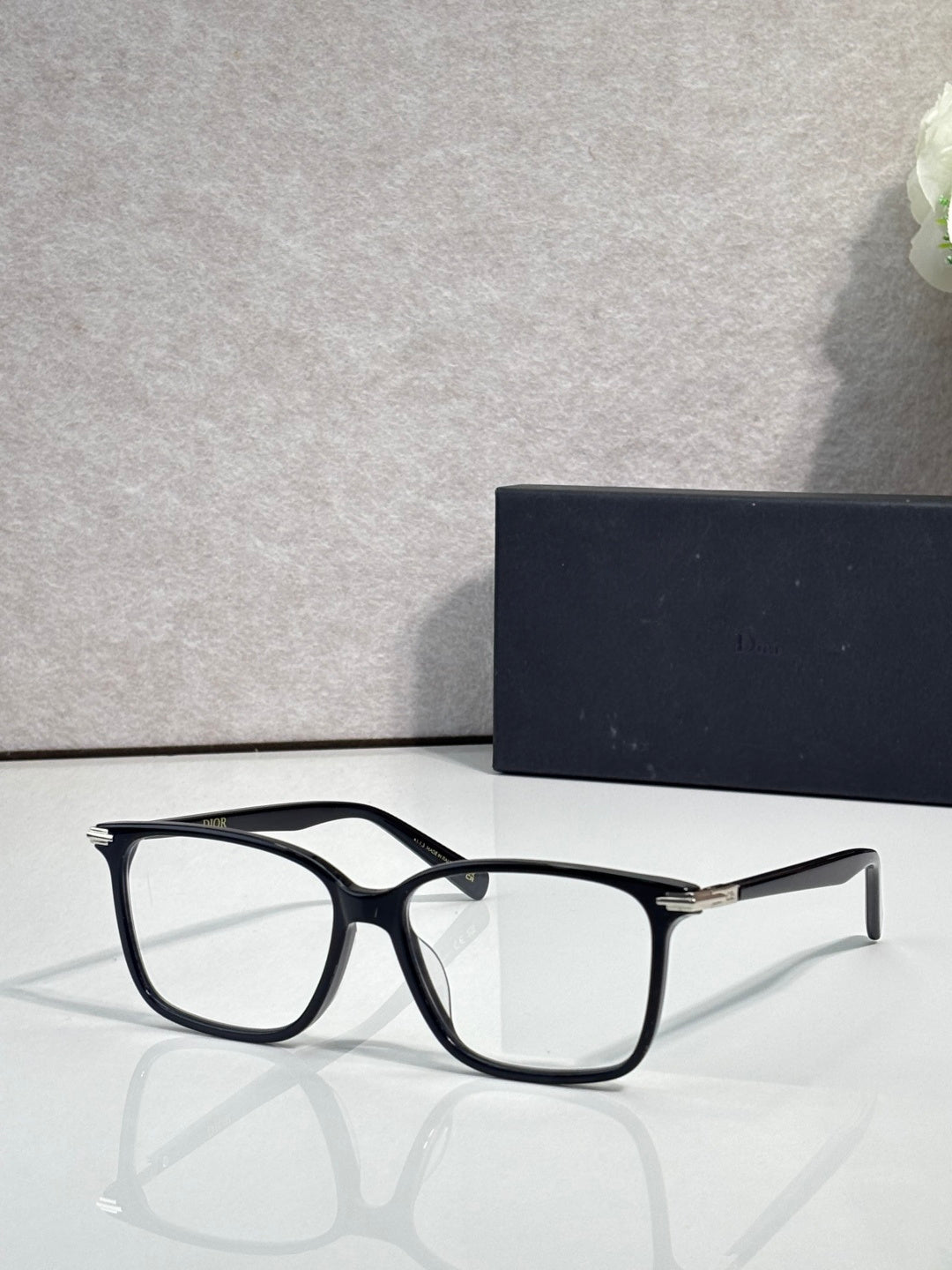 Dior eyeglasses with black rectangular frames and clear lenses