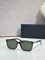 Dior eyeglasses with black frames and dark green tinted lenses