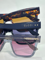 Gucci sunglasses stack with tortoiseshell top frame and dark blue frames, pink lens fronts