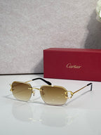 Sunglasses with gold frame and pale yellow mirrored lenses