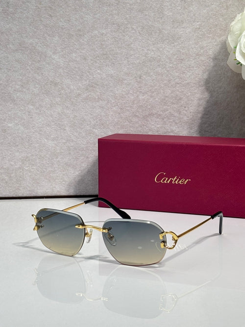 Cartier sunglasses with gold frame and light gray mirrored lenses