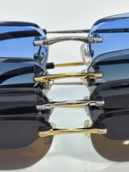Sunglasses close-up: gold and silver temples with blue and dark lenses