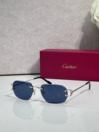 Cartier round-frame sunglasses with blue gradient lenses and black top rim
